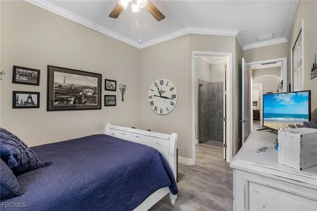 a bedroom with a bed and a couch