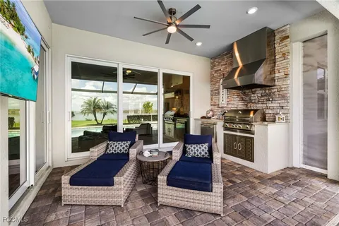 a living room with fireplace furniture and a window