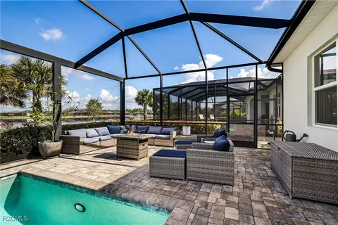a outdoor living space with furniture and umbrella