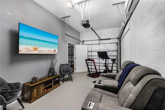 a living room with furniture a couch and a window