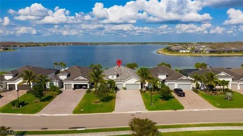 an aerial view of a house with a ocean view