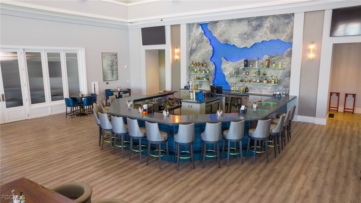 13424 Blue Bay Circle Fort Myers, FL 33913 - Photo 36 of 45 a view of a dining room with furniture window and wooden floor