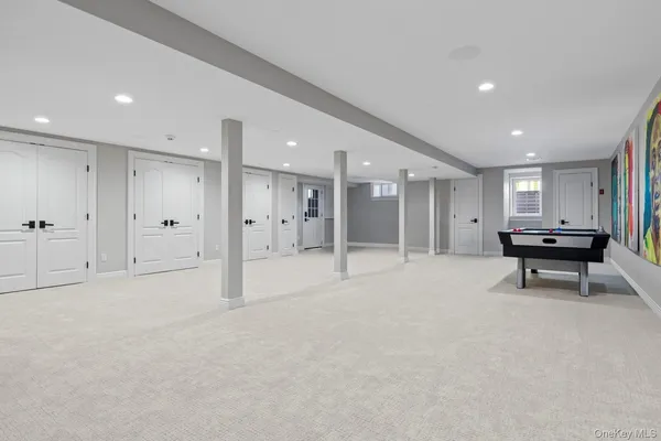 a view of an empty room with a mirror