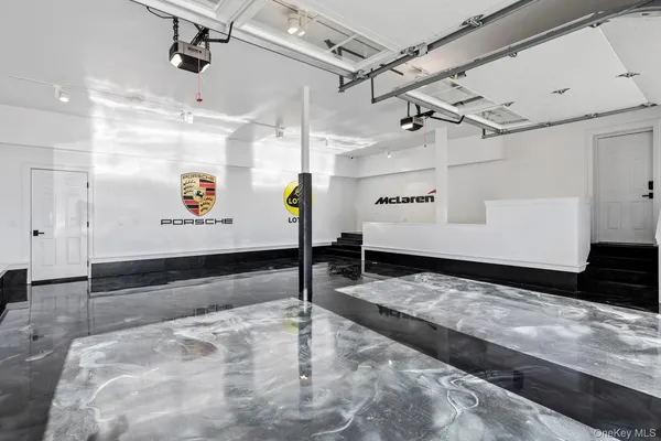 a view of a lake with lawn chairs