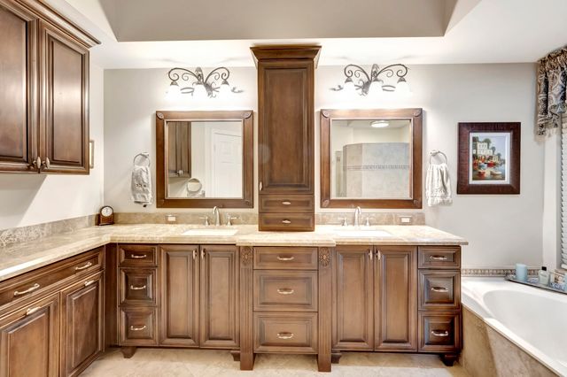 a bedroom with double bed windows and a flat screen tv