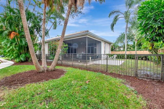 a front view of a house with a yard table and chairs