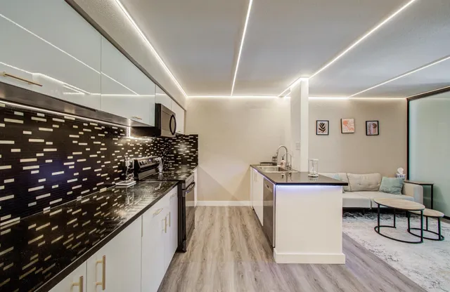 a kitchen with a sink and cabinets