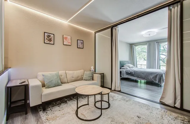 a living room with furniture and a view of living room