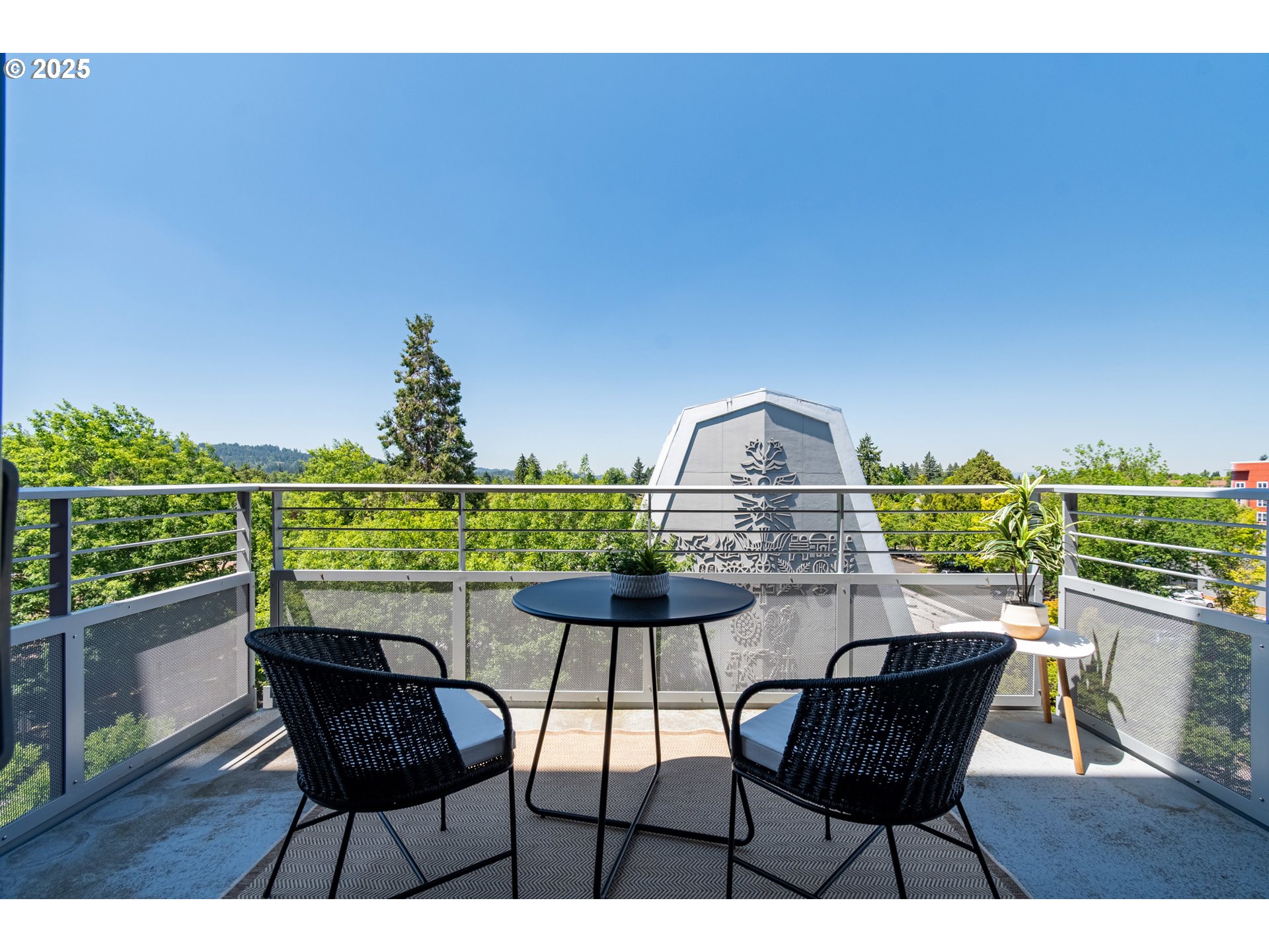 1375 Olive Street, Unit 505 Eugene, OR 97401 - Photo 26 of 33 a view of a chairs and table on the terrace