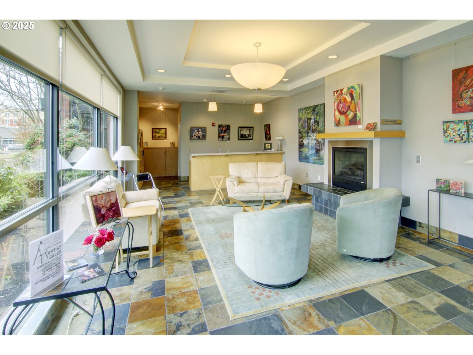 1375 Olive Street, Unit 505 Eugene, OR 97401 - Photo 32 of 33 a living room with fireplace furniture and a large window
