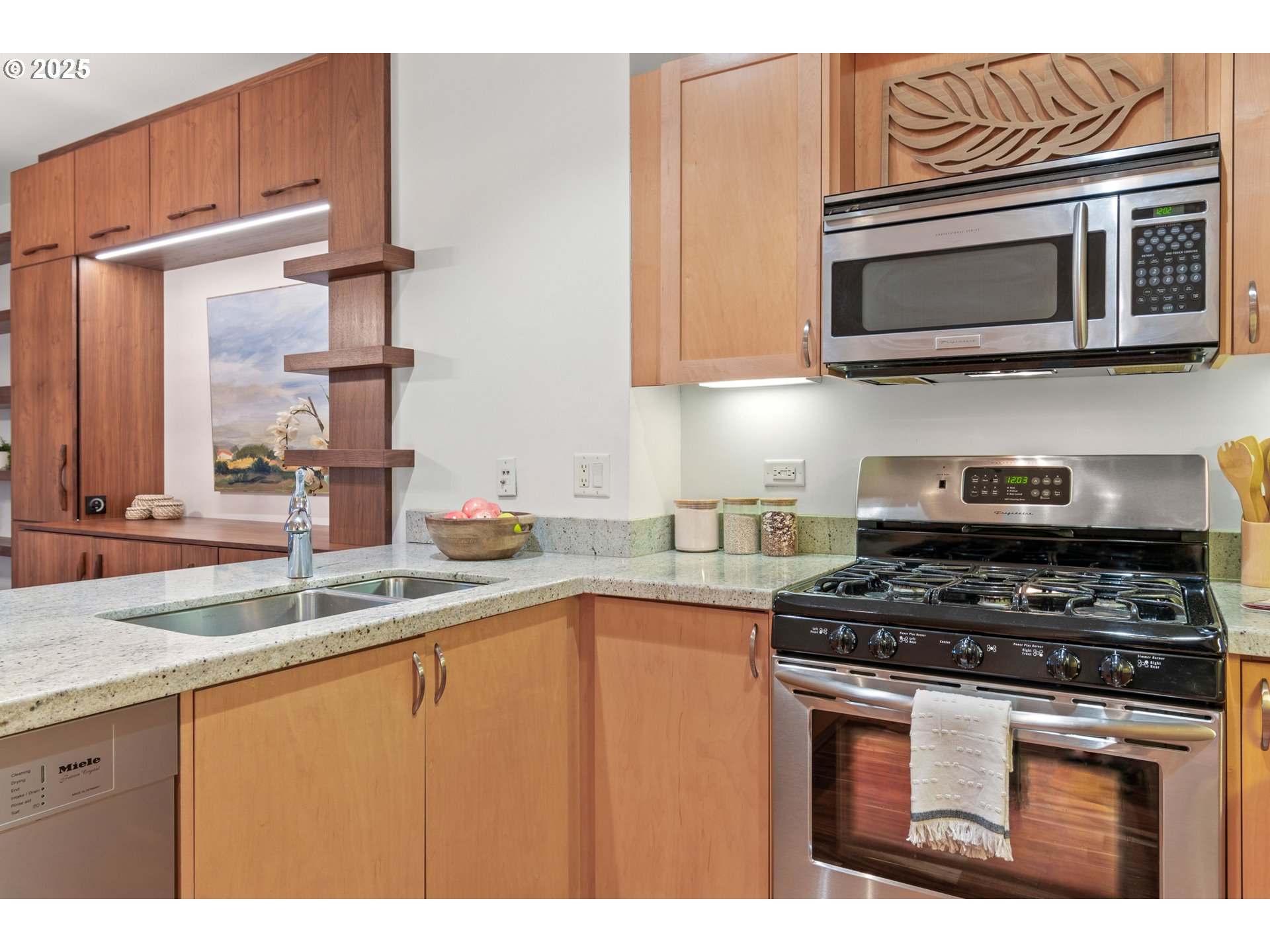 1375 Olive Street, Unit 505 Eugene, OR 97401 - Photo 6 of 33 a kitchen with stainless steel appliances granite countertop a stove microwave and sink