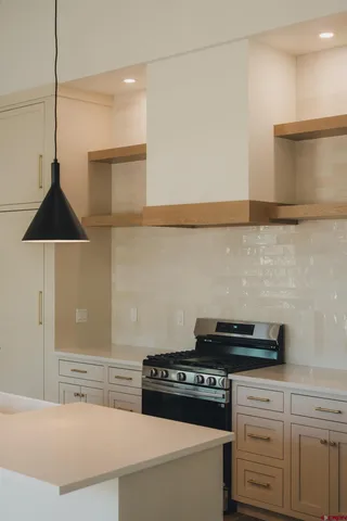 a kitchen with a stove and a cabinet