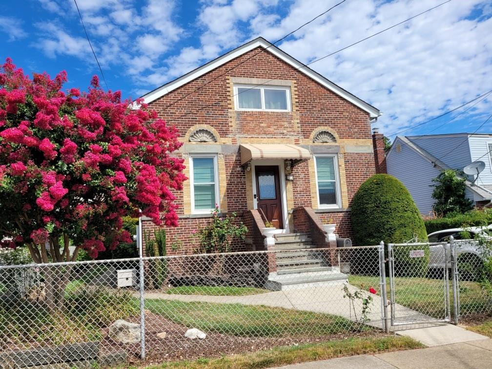 23 Lenox Avenue Westbury, NY 11590 - Photo 1 of 1 View of front of house with a front lawn