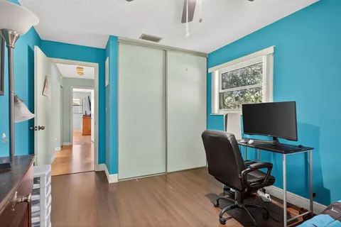 a bedroom with a workspace