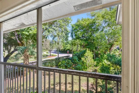 a bathroom with a granite countertop sink mirror and vanity