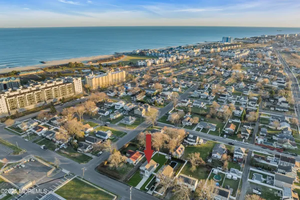 an aerial view of residential building and ocean