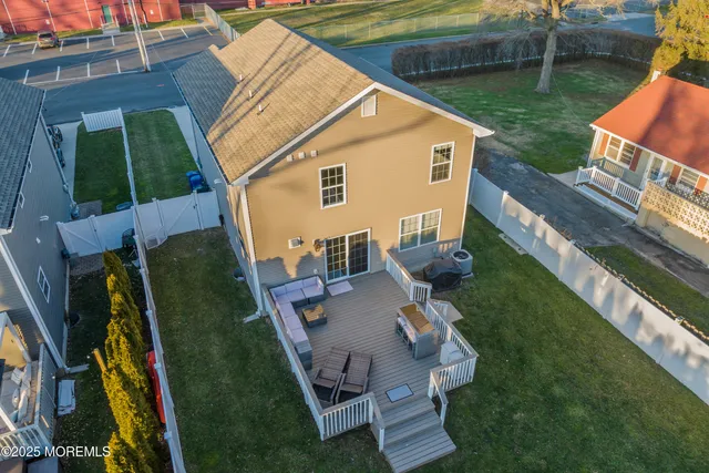 a aerial view of a house with swimming pool and porch