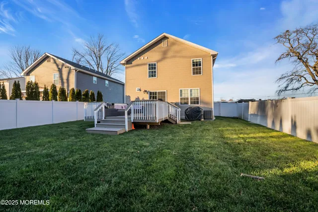 a view of backyard with barbeque oven and outdoor seating