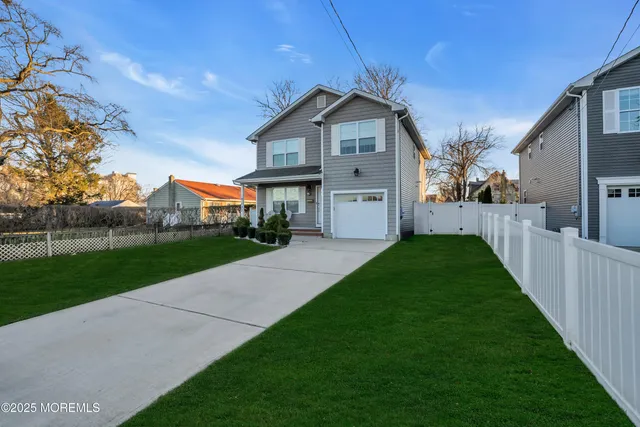 a front view of a house with yard