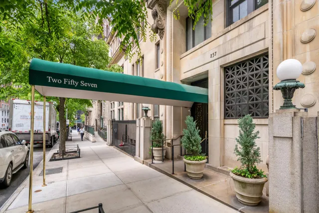 a view of a patio with table and chairs potted plants