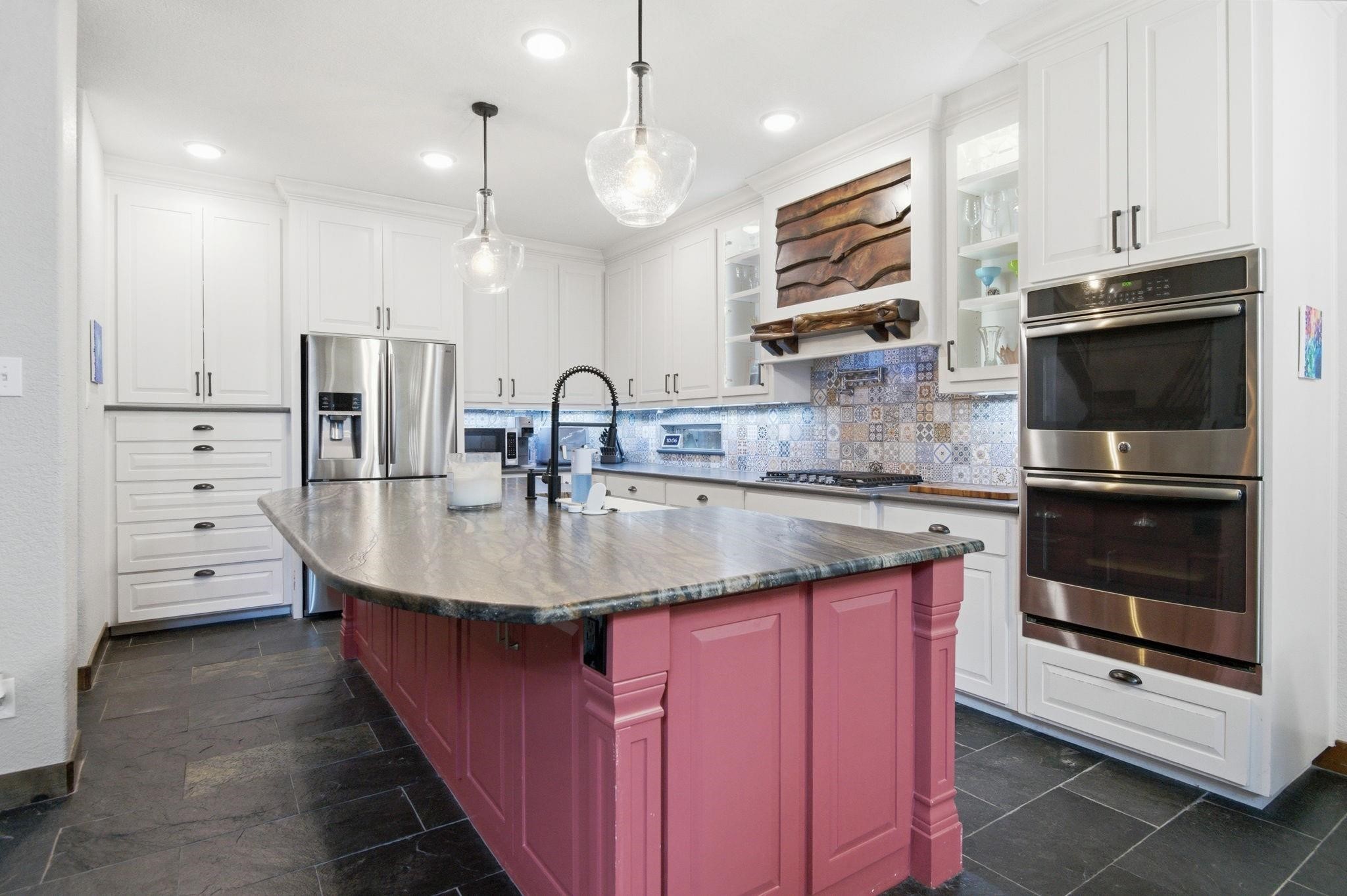6203 Cash Oaks Drive Spring, TX 77379 - Photo 4 of 35 Quartz, birch, and a whole lot of wow. This kitchen understood the assignment!