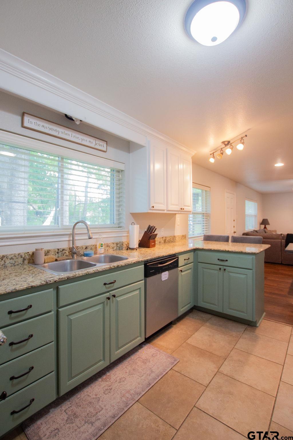 2110 Inwood Circle Tyler, TX 75701 - Photo 11 of 44 a kitchen with a sink and cabinets