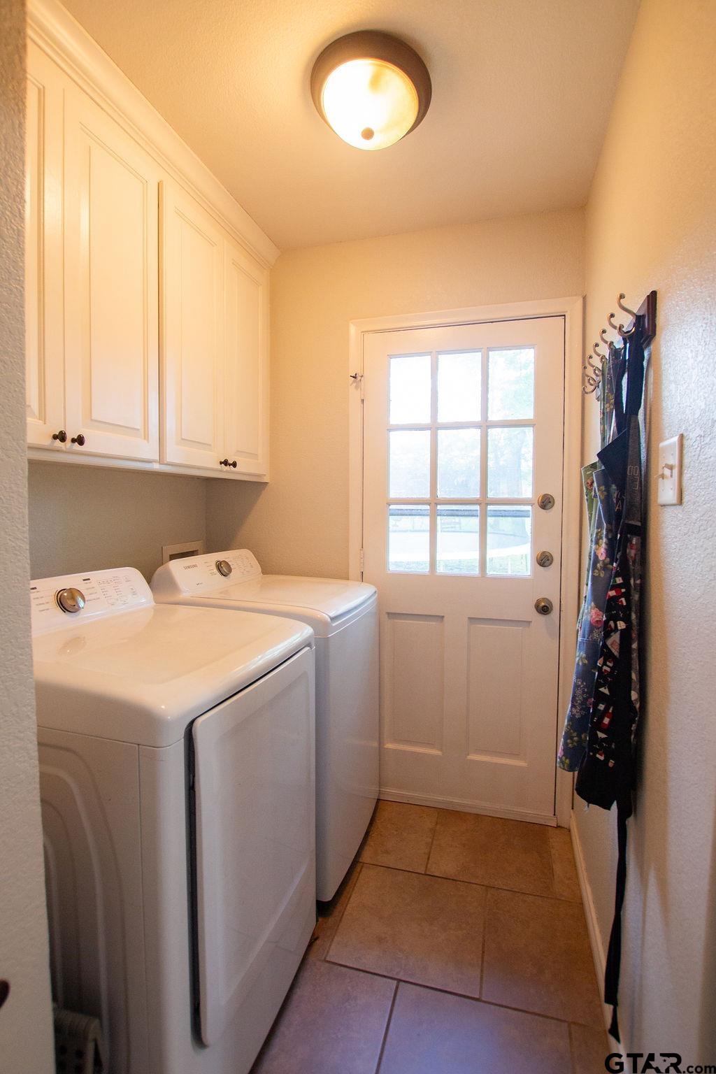 2110 Inwood Circle Tyler, TX 75701 - Photo 13 of 44 a utility room with dryer and washer