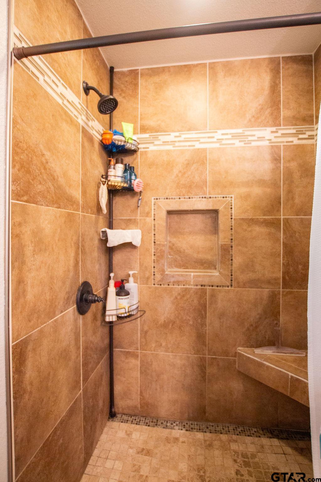 2110 Inwood Circle Tyler, TX 75701 - Photo 19 of 44 a bathroom with a shower