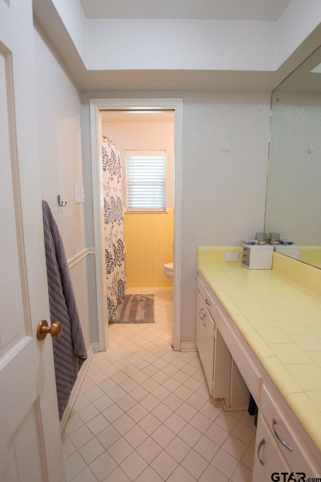 2110 Inwood Circle Tyler, TX 75701 - Photo 22 of 44 a room with a sink and a large window