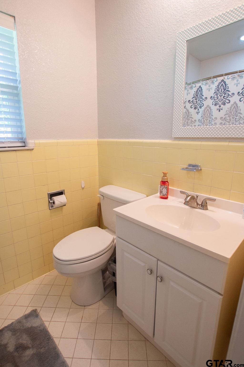 2110 Inwood Circle Tyler, TX 75701 - Photo 24 of 44 a bathroom with a sink and a toilet