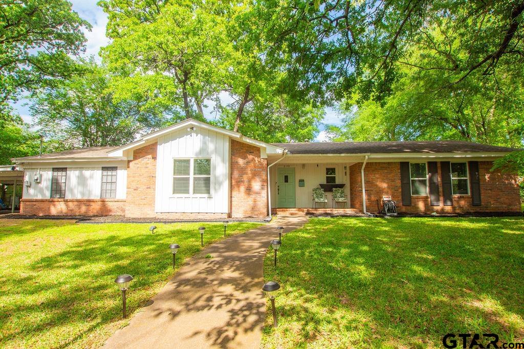 2110 Inwood Circle Tyler, TX 75701 - Photo 3 of 44 a front view of house with yard and green space