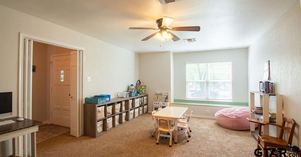 2110 Inwood Circle Tyler, TX 75701 - Photo 31 of 44 a dining room with furniture a chandelier and a window