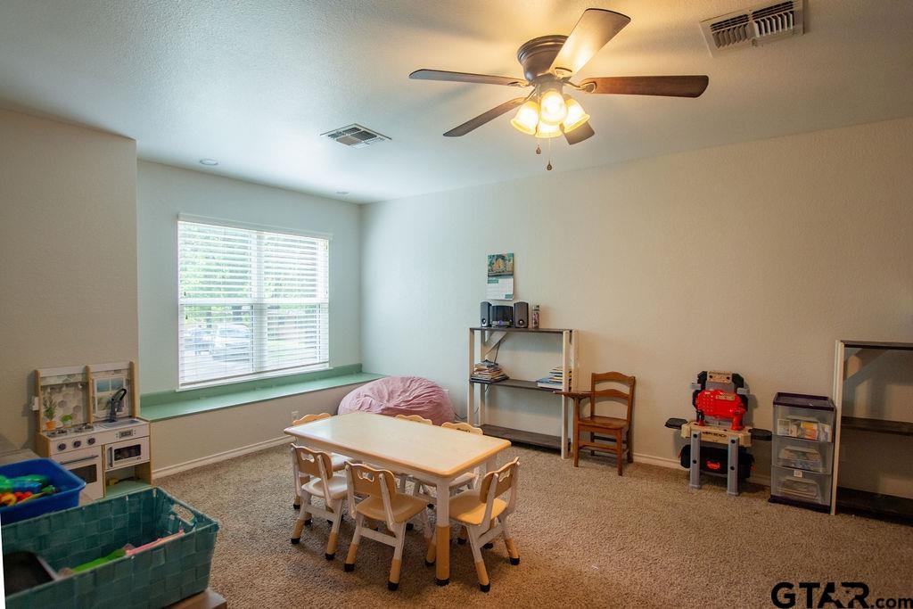 2110 Inwood Circle Tyler, TX 75701 - Photo 32 of 44 a living room with furniture and a window