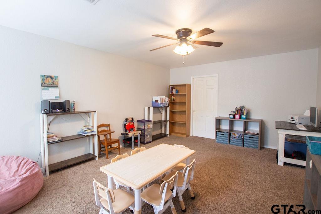 2110 Inwood Circle Tyler, TX 75701 - Photo 33 of 44 a living room with furniture and a dining table