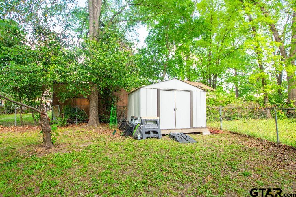 2110 Inwood Circle Tyler, TX 75701 - Photo 36 of 44 a view of backyard with a table and chairs