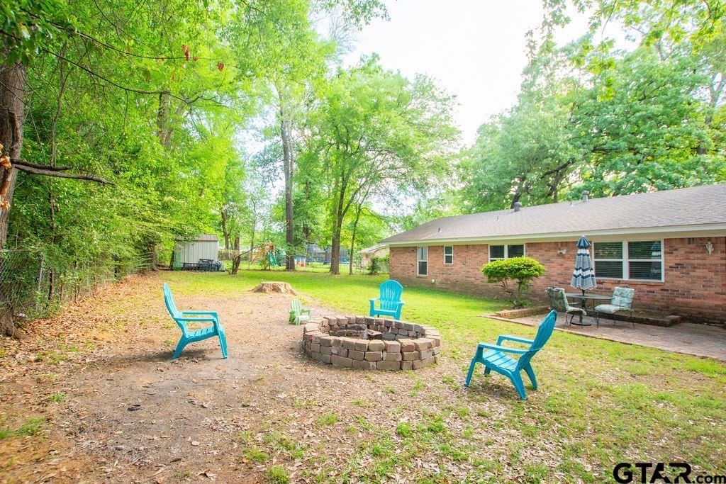 2110 Inwood Circle Tyler, TX 75701 - Photo 37 of 44 a view of a house with backyard patio and swimming pool