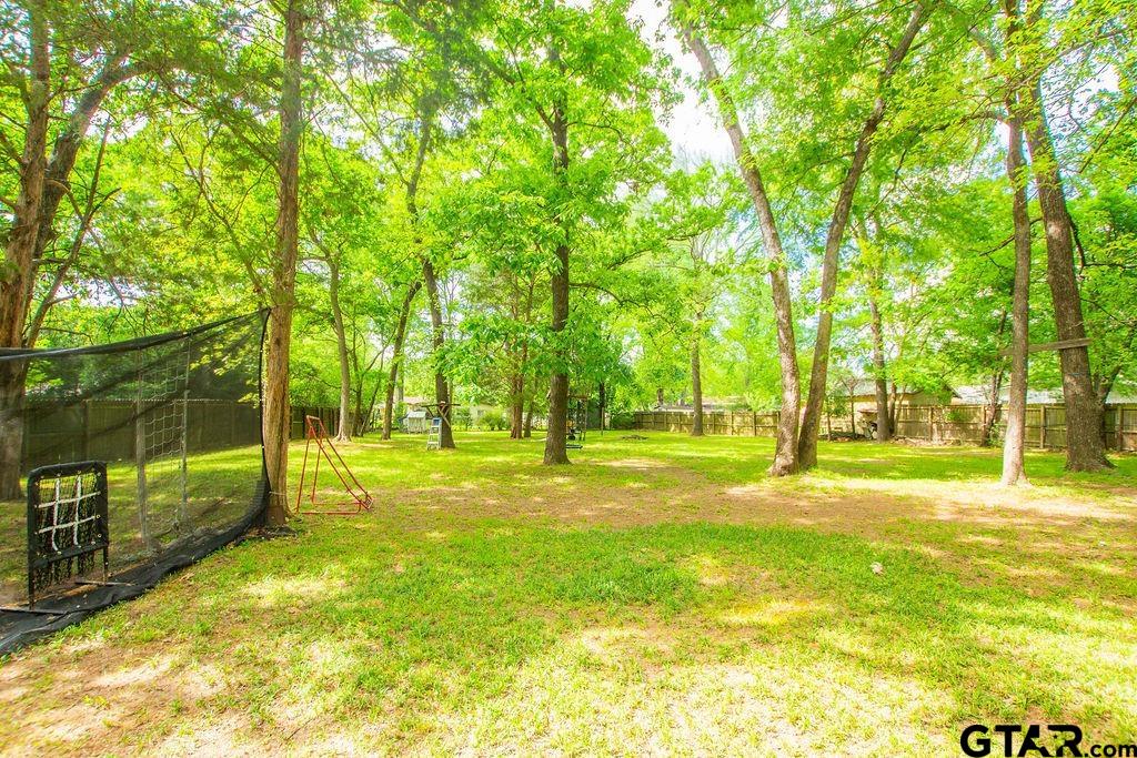 2110 Inwood Circle Tyler, TX 75701 - Photo 40 of 44 a view of a yard with swimming pool