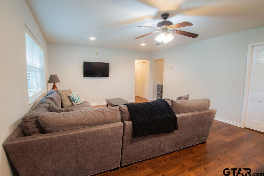 2110 Inwood Circle Tyler, TX 75701 - Photo 7 of 44 a living room with furniture and a flat screen tv