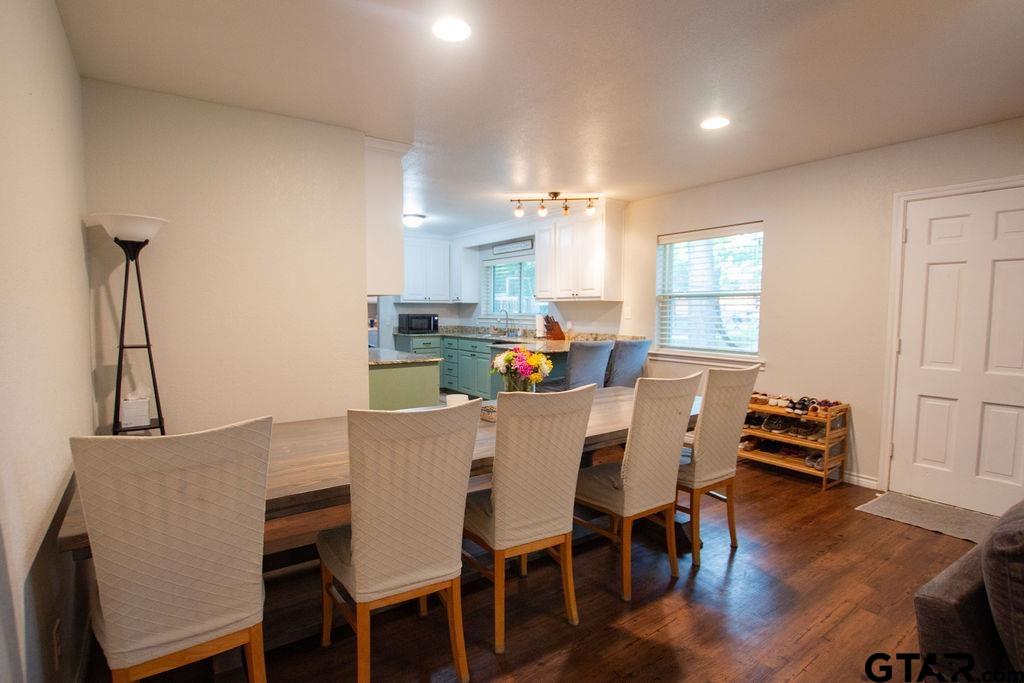 2110 Inwood Circle Tyler, TX 75701 - Photo 8 of 44 a view of a dining room with furniture and wooden floor