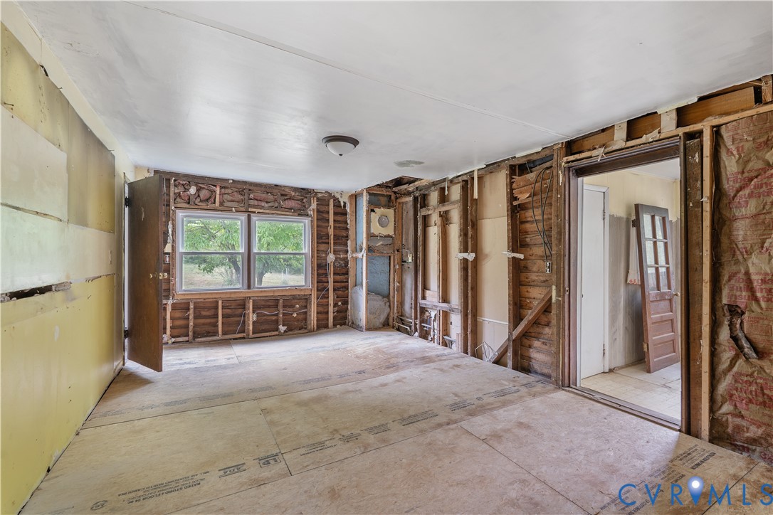 1497 Sutlers Road Charlottesville, VA 22902 - Photo 7 of 20 a view of an empty room with a window