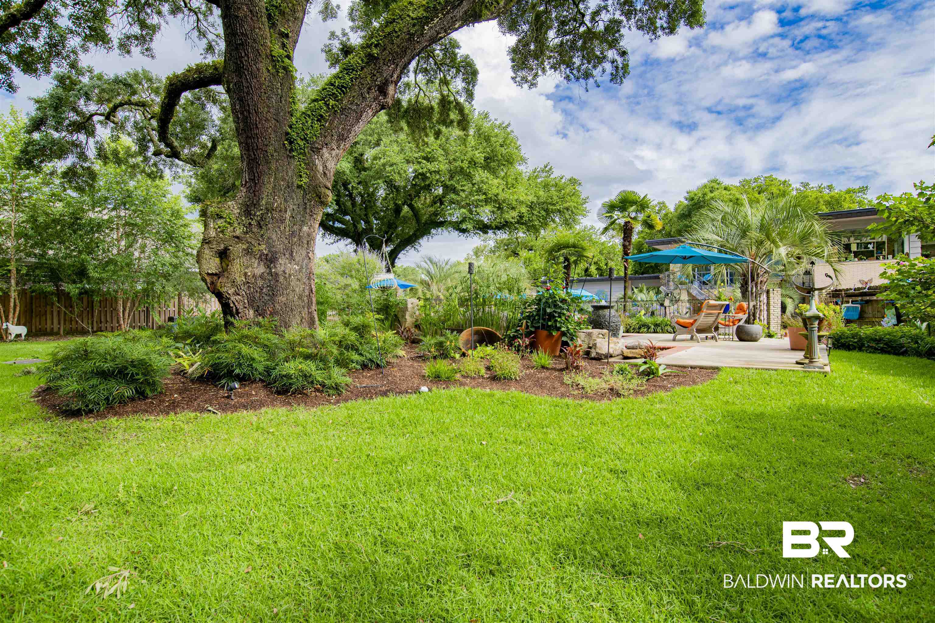 809 Bernard Circle Mobile, AL 36693 - Photo 68 of 75 Expansive green lawn featuring a mature oak tree with surrounding landscaping