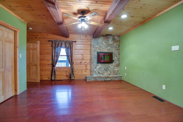 6009 Spring Hill Road Bridgewater, VA 22812 - Photo 6 of 25 a view of an empty room with wooden floor and a window