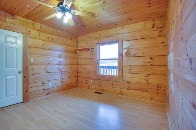6009 Spring Hill Road Bridgewater, VA 22812 - Photo 9 of 25 a view of an empty room with a window and wooden floor