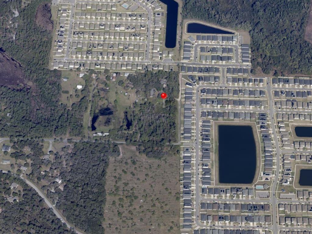 5455 North Eagle Road St. Cloud, FL 34771 - Photo 3 of 5 a brick building with a door
