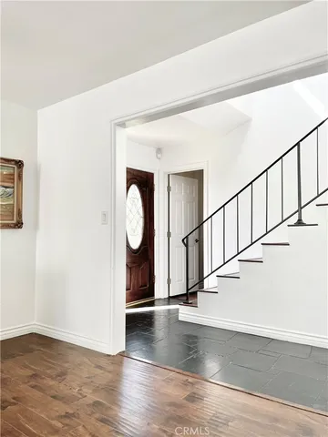 a view of entryway with wooden floor