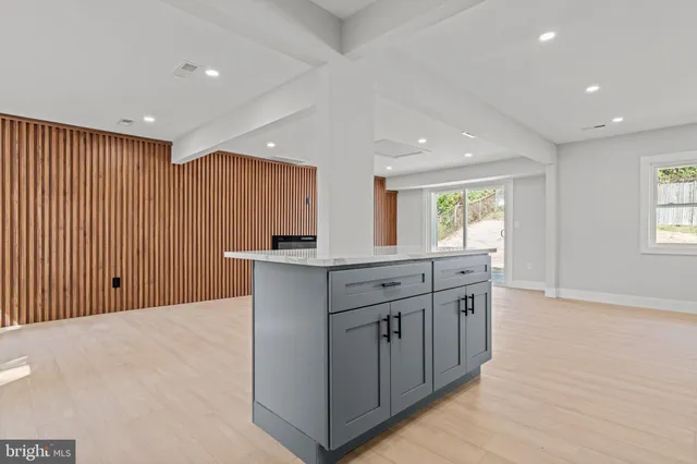 a kitchen with stainless steel appliances a sink stove and cabinets