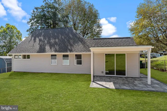 a view of a backyard with plants and a garden