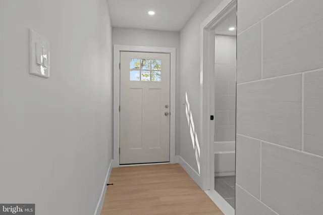 a view of an empty room with a kitchen