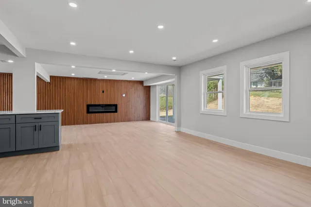 a view of kitchen with refrigerator and microwave