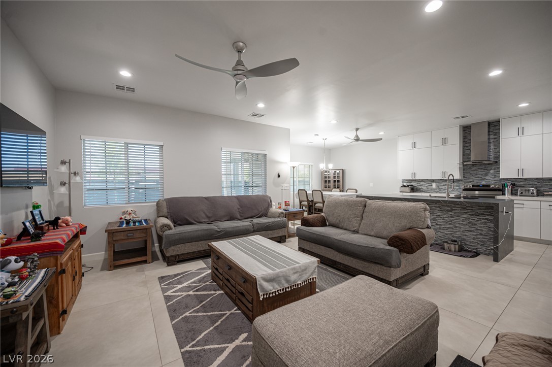 441 Belville Road Pahrump, NV 89048 - Photo 7 of 44 An open-concept living area boasts recessed lighting and durable tile flooring, flowing seamlessly into the kitchen.
